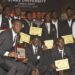 Starz University students and honorees pose with academic and humanitarian awards during the 2025 honors and awards ceremony in Paynesville.