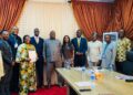 LERC officials and LEC representatives pose after signing the amended electricity distribution license