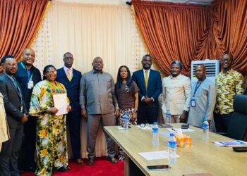 LERC officials and LEC representatives pose after signing the amended electricity distribution license