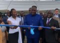 Vice President Jeremiah Koung cuts ribbon during launch of Liberia’s first semi-industrial fishing vessel