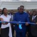 Vice President Jeremiah Koung cuts ribbon during launch of Liberia’s first semi-industrial fishing vessel