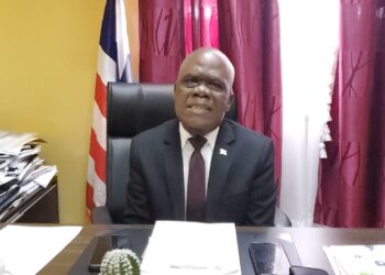 Senator Numene T. H. Bartekwa sits behind his desk at the Capitol Building during a press conference on electricity tariff concerns.