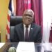 Senator Numene T. H. Bartekwa sits behind his desk at the Capitol Building during a press conference on electricity tariff concerns.