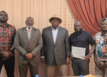 LERC Board members presenting Liberia’s first solar PV installer license to Mark McCauley