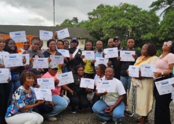 Nursing staff of ArcelorMittal Liberia’s Stephen A. Tolbert Memorial Hospital in Buchanan display certificates after completing a professional development retreat on patient care standards.