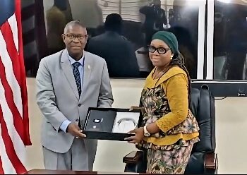 Liberia’s Foreign Minister Sara Beysolow Nyanti and ECOWAS Court President Ricardo Cláudio Monteiro Gonçalves exchange documents during the official visit in Monrovia reaffirming Liberia’s commitment to regional justice cooperation.