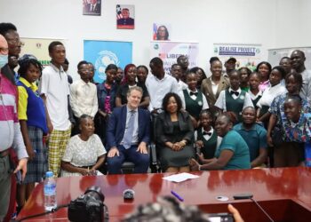 Deputy Minister Garmai Tokpah and partners pose with students and child advocates during the launch of Liberia’s 2025 World Children’s Day celebration in Monrovia.