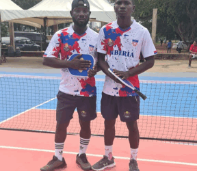 Liberia’s pickleball doubles team posing on court during the West Africa Regional Pickleball Tournament in Ghana
