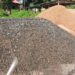 Piles of sand and crushed rocks donated to support the New Kru Town community bridge project linking Trowin and Mombo Towns.