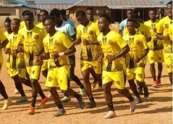 Bea Mountain FC players enter the pitch before a match in Grand Cape Mount County, days before the LFA sanctioned the club for crowd violence