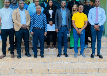 A group of journalists and officials standing together after a professional training workshop.