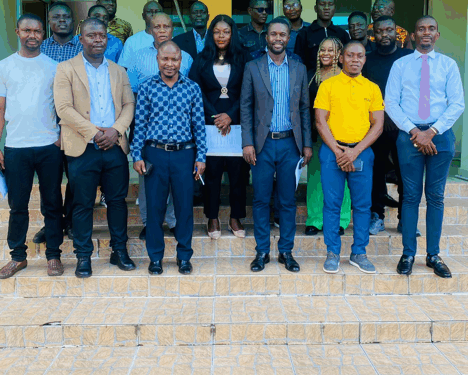 A group of journalists and officials standing together after a professional training workshop.