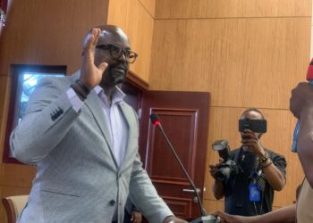 Public Works Minister Roland Giddings presents the government’s Jor River Bridge plan during plenary as criticism mounts over alleged inflated costs