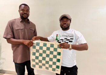 ICP President William Telebo Thompson presenting chess equipment to Ghana Chess Association representative in Accra.
