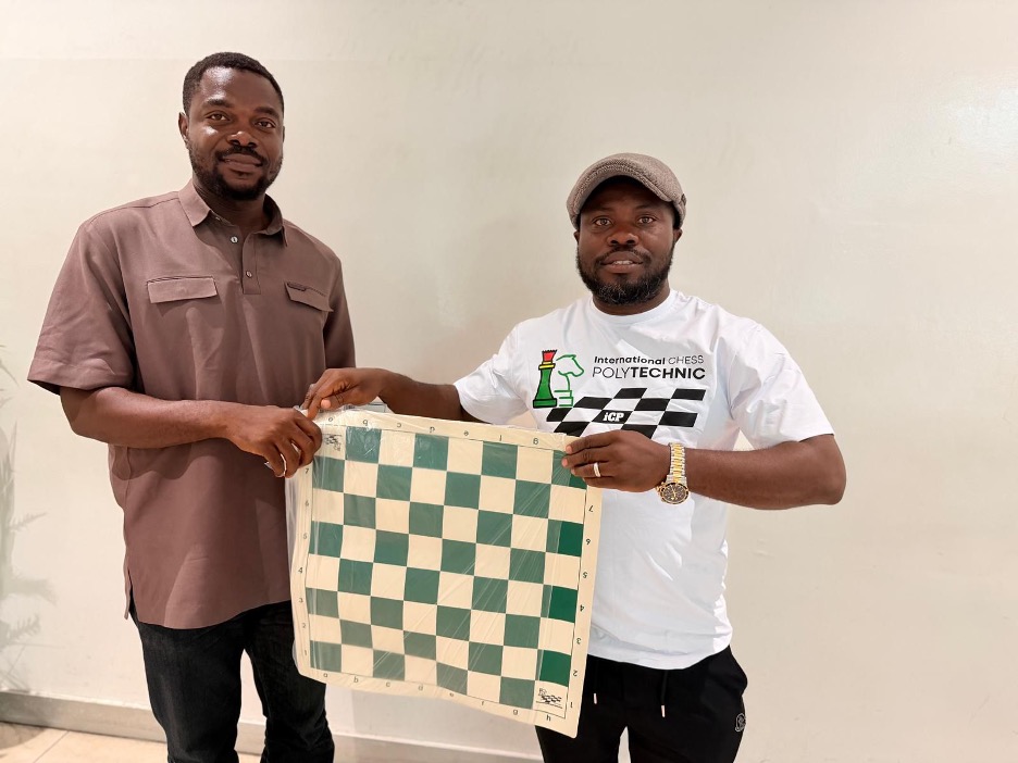 ICP President William Telebo Thompson presenting chess equipment to Ghana Chess Association representative in Accra.