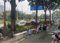 Urban street in Guangzhou, China, with bicycles, trees and pedestrian spaces — captured by B. Garmondyu Zogar (2025).