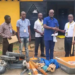 Harper City Mayor Abraham Jackson receives sanitation tools from LPRC representatives, including wheelbarrows, shovels and cutlasses, to support the city’s cleanup campaign