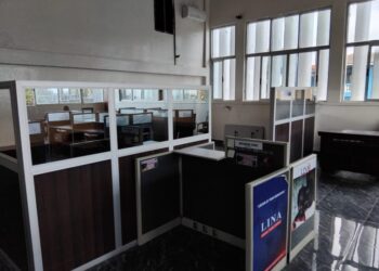 Liberia News Agency newsroom showing empty cubicles, damaged furniture, and inactive workstations, reflecting the declining operational state described by staff.