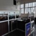 Liberia News Agency newsroom showing empty cubicles, damaged furniture, and inactive workstations, reflecting the declining operational state described by staff.