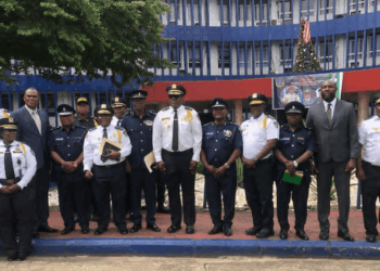 Liberia and Sierra Leone police delegations pose at LNP Headquarters during a bilateral security cooperation meeting in Monrovia.
