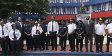 Liberia and Sierra Leone police delegations pose at LNP Headquarters during a bilateral security cooperation meeting in Monrovia.