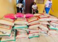 Mr. Sio and Rep. Seboe distribute rice to residents