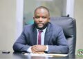 NPA Managing Director Sekou A.M. Dukuly seated at his desk during an official meeting.