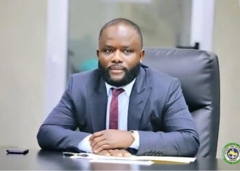 NPA Managing Director Sekou A.M. Dukuly seated at his desk during an official meeting.