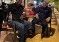Jake Kabakole of Vision Basketball Liberia and Opeyemi Babalola of Webber Hoops & Courts seated outdoors during a pre-signing meeting in Monrovia