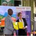 A Liberian official and a French Development Agency representative hold signed cooperation documents during the launch of the €9M WISE forest conservation initiative.