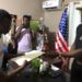 Anthony T. Cole hands over legal documents of the Zenna Hill Estate to family members during a formal ceremony in Paynesville, Liberia
