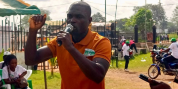 Fedrick Gunor Howard speaking passionately during a Unity Party fundraising rally in Zwedru, confronting VP Koung over grassroots neglect
