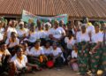 A large group of women from the Friends of Collins Village Savings Association in Borlia, Gbarpolu County, pose together during their 2024–2025 graduation ceremony after achieving an L$8 million savings milestone