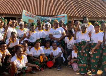 A large group of women from the Friends of Collins Village Savings Association in Borlia, Gbarpolu County, pose together during their 2024–2025 graduation ceremony after achieving an L$8 million savings milestone