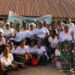 A large group of women from the Friends of Collins Village Savings Association in Borlia, Gbarpolu County, pose together during their 2024–2025 graduation ceremony after achieving an L$8 million savings milestone