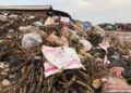 Garbage piles overwhelm the Plantain Field area of Omega General Market in Monrovia, forcing vendors to operate amid unsanitary conditions
