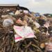 Garbage piles overwhelm the Plantain Field area of Omega General Market in Monrovia, forcing vendors to operate amid unsanitary conditions