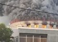 Smoke and flames engulf the Liberian Capitol Building during the 2024 fire at the center of the ongoing arson trial