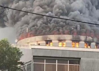Smoke and flames engulf the Liberian Capitol Building during the 2024 fire at the center of the ongoing arson trial