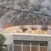 Smoke and flames engulf the Liberian Capitol Building during the 2024 fire at the center of the ongoing arson trial