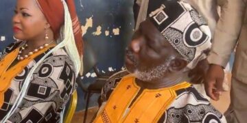 Macdella Cooper seated beside House Speaker Richard Nagbe Koon during a public engagement in southeastern Liberia