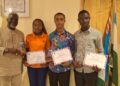 Grand Gedeh scholarship beneficiaries present certificates to Senator Emmanuel Zoe Pennue at the Capitol Building in Monrovia