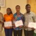 Grand Gedeh scholarship beneficiaries present certificates to Senator Emmanuel Zoe Pennue at the Capitol Building in Monrovia