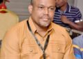Financial Intelligence Agency official reacts after FIA vehicle was vandalized during the Lead or Leave protest in Monrovia
