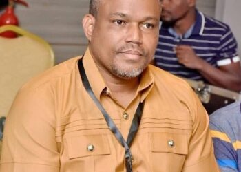 Financial Intelligence Agency official reacts after FIA vehicle was vandalized during the Lead or Leave protest in Monrovia