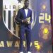 Liberian football player poses with trophy during the Liberia Football Association End-of-Season Awards ceremony
