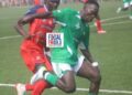 Players from competing counties battle for possession during a National County Sports Meet group-stage match in Liberia