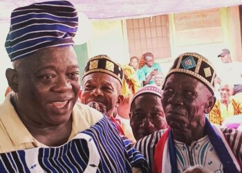 Representative Bernard Blue Benson Jr. receives traditional honors from elders during a cultural ceremony in Montserrado County.