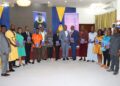 Civil Service Agency Director General Josiah F. Joekai Jr. poses with university leaders during the launch of his gender inequality study in Monrovia