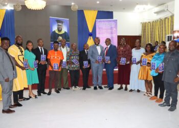Civil Service Agency Director General Josiah F. Joekai Jr. poses with university leaders during the launch of his gender inequality study in Monrovia
